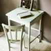 oude kinderlessenaar schoolbank kinderbureau